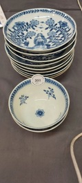 Nine Chinese blue and white 'Madonna and Child' saucers and two cups, Kangxi