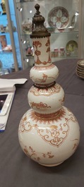 A Chinese iron-red and gilt-decorated triple gourd vase, Kangxi