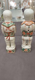 A pair of Chinese famille verte 'Hehe Er Xian' figures, Kangxi