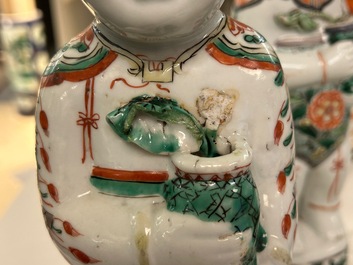 A pair of Chinese famille verte 'Hehe Er Xian' figures, Kangxi