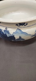 A Chinese blue and white tripod censer with figures in a mountainous landscape, Kangxi