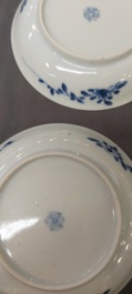 Nine Chinese blue and white 'Madonna and Child' saucers and two cups, Kangxi