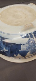 A Chinese blue and white tripod censer with figures in a mountainous landscape, Kangxi