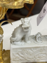 A Chinese Dehua blanc de Chine joss stick holder with French gilt bronze candlestick mounts, Kangxi and 18/19th C.
