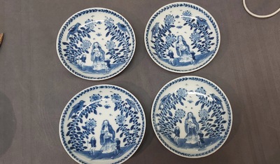 Nine Chinese blue and white 'Madonna and Child' saucers and two cups, Kangxi