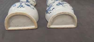 A pair of Chinese blue and white wall pocket vases with antiquities, Kangxi