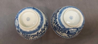 Nine Chinese blue and white 'Madonna and Child' saucers and two cups, Kangxi
