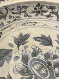 A Vietnamese or Annamese blue and white dish, a Thai Sawankhalok dish and a pair of celadon figures, 14th C. and later