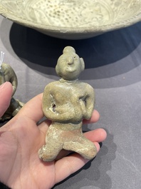 A Vietnamese or Annamese blue and white dish, a Thai Sawankhalok dish and a pair of celadon figures, 14th C. and later