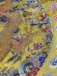 An imperial Chinese embroidered silk gold-thread yellow-ground cushion cover, 19th C.