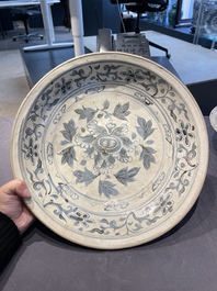 A Vietnamese or Annamese blue and white dish, a Thai Sawankhalok dish and a pair of celadon figures, 14th C. and later