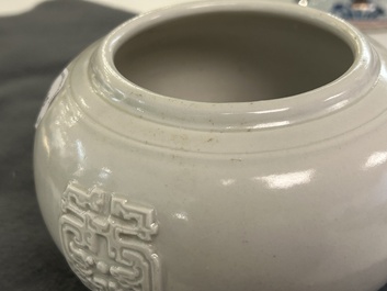 A Chinese white-glazed relief-molded bowl, Qianlong mark, 19th C.