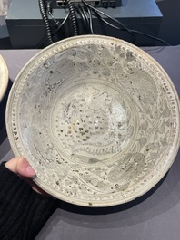A Vietnamese or Annamese blue and white dish, a Thai Sawankhalok dish and a pair of celadon figures, 14th C. and later