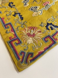 An imperial Chinese embroidered silk gold-thread yellow-ground cushion cover, 19th C.