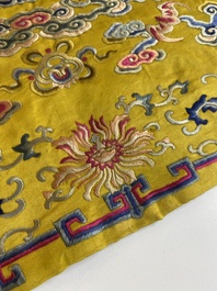 An imperial Chinese embroidered silk gold-thread yellow-ground cushion cover, 19th C.