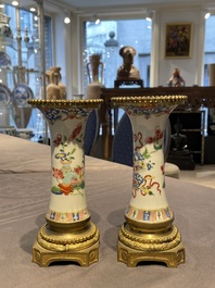 Une paire de vases en porcelaine de Chine famille rose aux montures en bronze dor&eacute; et une chope &agrave; sujet mandarin, Qianlong