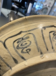 A Vietnamese or Annamese blue and white dish, a Thai Sawankhalok dish and a pair of celadon figures, 14th C. and later