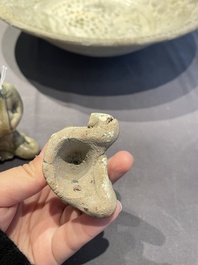 A Vietnamese or Annamese blue and white dish, a Thai Sawankhalok dish and a pair of celadon figures, 14th C. and later