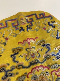 An imperial Chinese embroidered silk gold-thread yellow-ground cushion cover, 19th C.