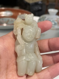 A Chinese white and russet jade sculpture of two boys, Qing