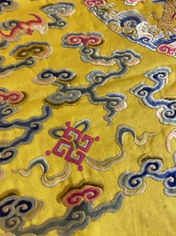 An imperial Chinese embroidered silk gold-thread yellow-ground cushion cover, 19th C.
