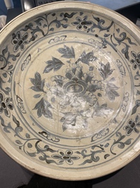 A Vietnamese or Annamese blue and white dish, a Thai Sawankhalok dish and a pair of celadon figures, 14th C. and later