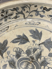 A Vietnamese or Annamese blue and white dish, a Thai Sawankhalok dish and a pair of celadon figures, 14th C. and later