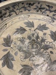 A Vietnamese or Annamese blue and white dish, a Thai Sawankhalok dish and a pair of celadon figures, 14th C. and later