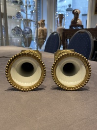 Une paire de vases en porcelaine de Chine famille rose aux montures en bronze dor&eacute; et une chope &agrave; sujet mandarin, Qianlong