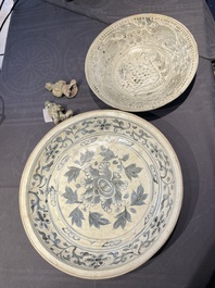 A Vietnamese or Annamese blue and white dish, a Thai Sawankhalok dish and a pair of celadon figures, 14th C. and later