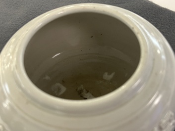 A Chinese white-glazed relief-molded bowl, Qianlong mark, 19th C.