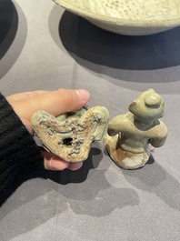 A Vietnamese or Annamese blue and white dish, a Thai Sawankhalok dish and a pair of celadon figures, 14th C. and later