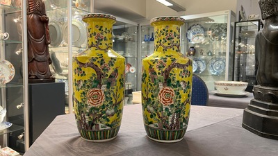 A pair of Chinese yellow-ground famille verte rouleau vases, 19th C.