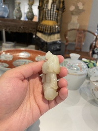 A Chinese white and russet jade sculpture of two boys, Qing
