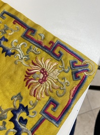 An imperial Chinese embroidered silk gold-thread yellow-ground cushion cover, 19th C.