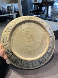A Vietnamese or Annamese blue and white dish, a Thai Sawankhalok dish and a pair of celadon figures, 14th C. and later