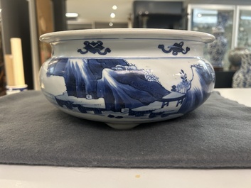 A Chinese blue and white tripod censer with figures in a mountainous landscape, Kangxi