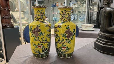 A pair of Chinese yellow-ground famille verte rouleau vases, 19th C.