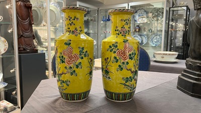 A pair of Chinese yellow-ground famille verte rouleau vases, 19th C.