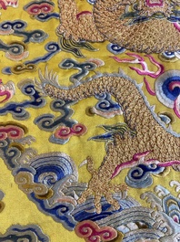 An imperial Chinese embroidered silk gold-thread yellow-ground cushion cover, 19th C.
