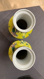 A pair of Chinese yellow-ground famille verte rouleau vases, 19th C.