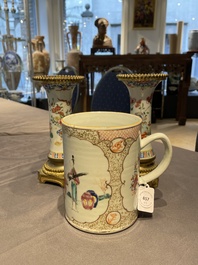 Une paire de vases en porcelaine de Chine famille rose aux montures en bronze dor&eacute; et une chope &agrave; sujet mandarin, Qianlong