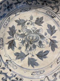 A Vietnamese or Annamese blue and white dish, a Thai Sawankhalok dish and a pair of celadon figures, 14th C. and later