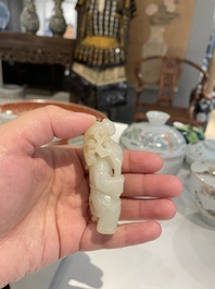 A Chinese white and russet jade sculpture of two boys, Qing