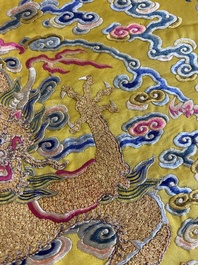 An imperial Chinese embroidered silk gold-thread yellow-ground cushion cover, 19th C.