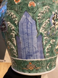 A pair of Chinese famille verte 'galloping horses' vases and covers, 19th C.