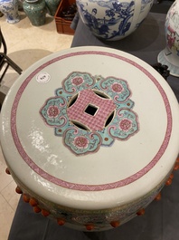 A Chinese famille rose garden seat with ladies in a garden, 20th C.