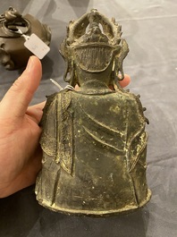 A Chinese bronze Buddha and a peach-shaped incense burner, Ming and Qing