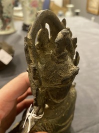 A Chinese bronze Buddha and a peach-shaped incense burner, Ming and Qing