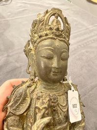 A Chinese bronze Buddha and a peach-shaped incense burner, Ming and Qing